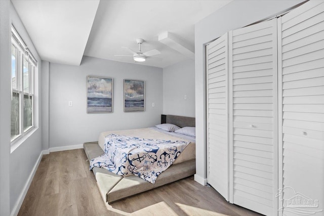 bedroom featuring ceiling fan and light hardwood / wood-style floors