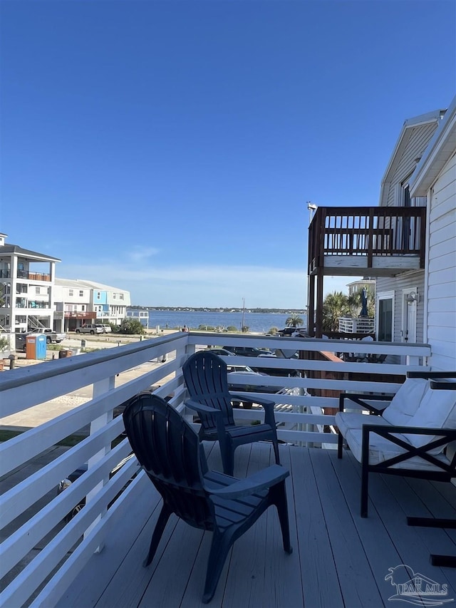 wooden deck featuring a water view