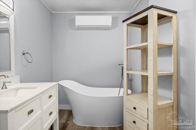 bathroom with an AC wall unit, hardwood / wood-style flooring, a bathtub, vanity, and ornamental molding