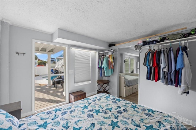 bedroom featuring a textured ceiling and a closet