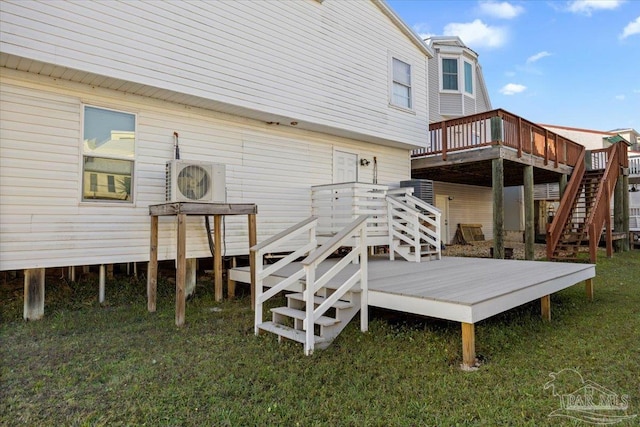 back of house featuring a yard and a deck