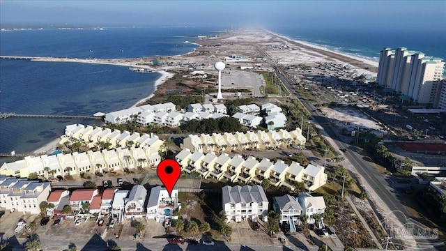 aerial view with a water view and a beach view