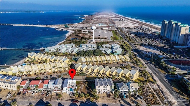 bird's eye view featuring a view of the beach and a water view