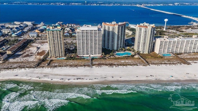 aerial view featuring a view of the beach and a water view