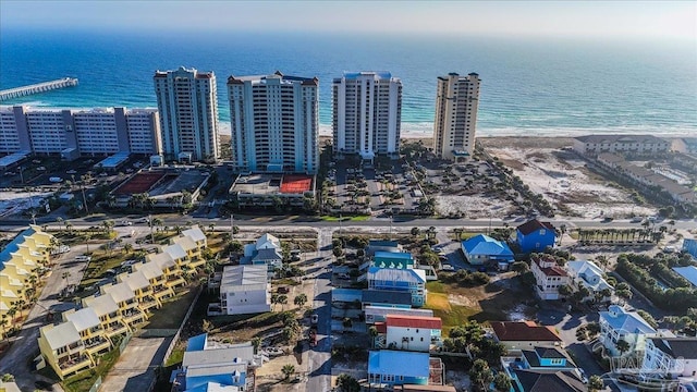 birds eye view of property featuring a water view and a view of the beach