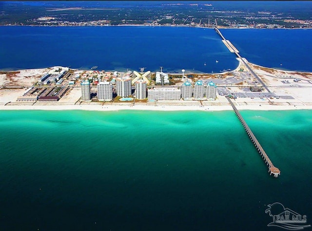 birds eye view of property with a water view and a view of the beach