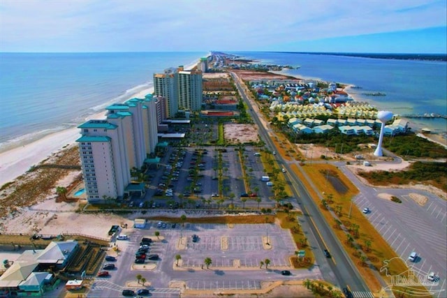 bird's eye view featuring a view of the beach and a water view