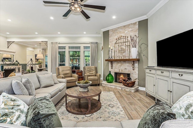 3160 Mountain Laurel Trl, Cantonment, FL 32533 - living room featuring ceiling fan, a fireplace, ornamental molding, recessed lighting, and light wood finished floors
