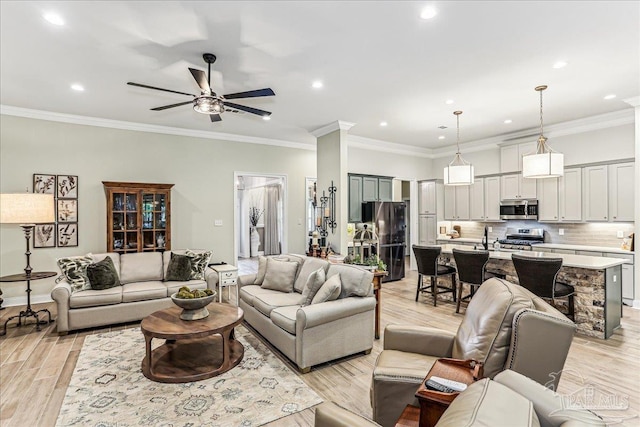 3160 Mountain Laurel Trl, Cantonment, FL 32533 - living room featuring a ceiling fan, light wood-style floors, recessed lighting, and crown molding