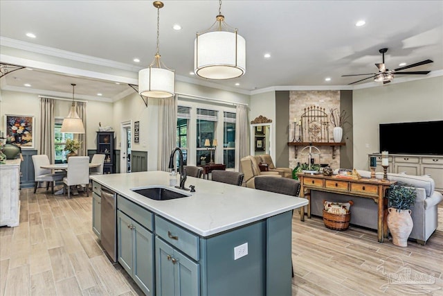 3160 Mountain Laurel Trl, Cantonment, FL 32533 - kitchen featuring open floor plan, recessed lighting, ceiling fan, a center island with sink, and light wood-style flooring