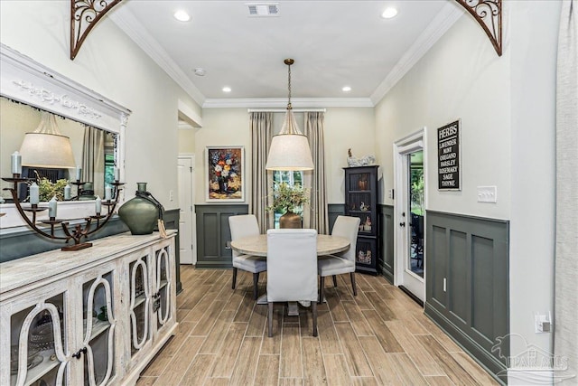 3160 Mountain Laurel Trl, Cantonment, FL 32533 - dining room with crown molding, light wood-style flooring, and recessed lighting