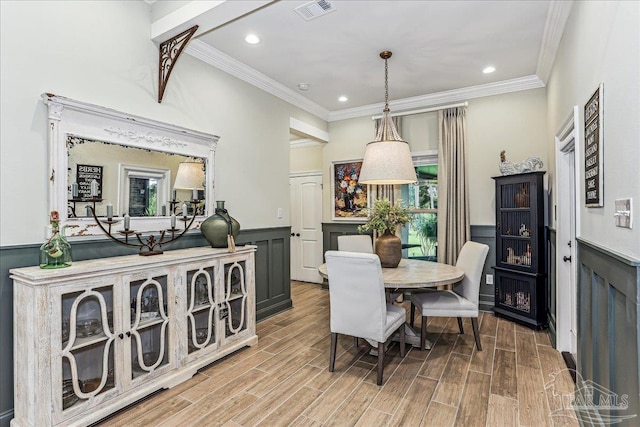 3160 Mountain Laurel Trl, Cantonment, FL 32533 - dining room featuring crown molding, wood finished floors, wainscoting, and recessed lighting