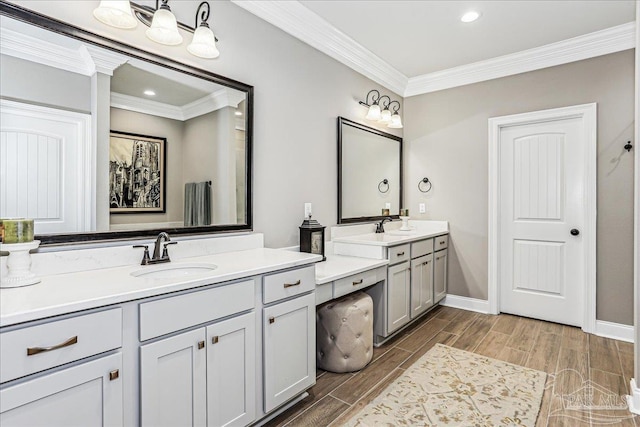 3160 Mountain Laurel Trl, Cantonment, FL 32533 - bathroom featuring two vanities, crown molding, wood finished floors, and recessed lighting