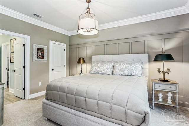 3160 Mountain Laurel Trl, Cantonment, FL 32533 - bedroom featuring ornamental molding, a decorative wall, and light carpet