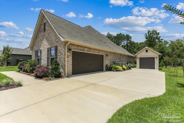3160 Mountain Laurel Trl, Cantonment, FL 32533 - view of property exterior featuring brick siding, roof with shingles, an attached garage, and a lawn
