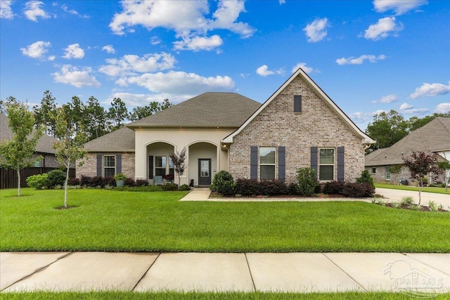 3160 Mountain Laurel Trl, Cantonment, FL 32533 - traditional-style home featuring a front lawn, brick siding, and roof with shingles