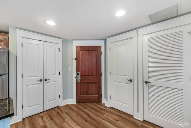 entrance foyer with light hardwood / wood-style floors