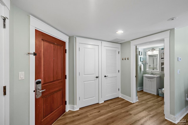 interior space with light wood-type flooring and sink