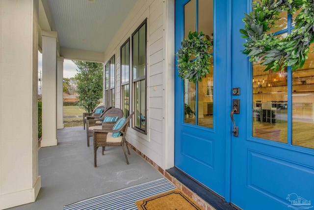 doorway to property with covered porch