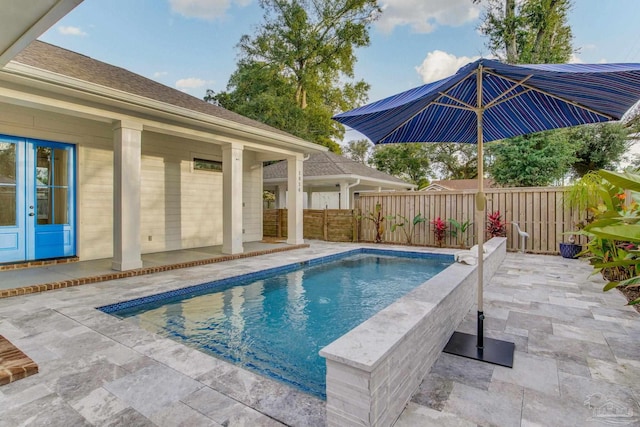 view of swimming pool with a patio area