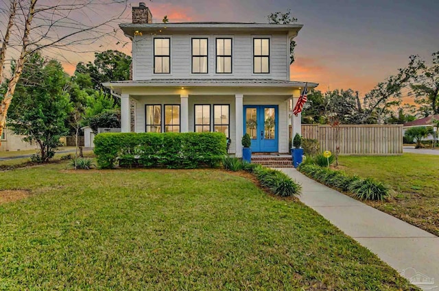 view of front of house with a lawn