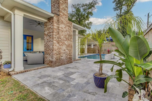 view of pool featuring ceiling fan and a patio area