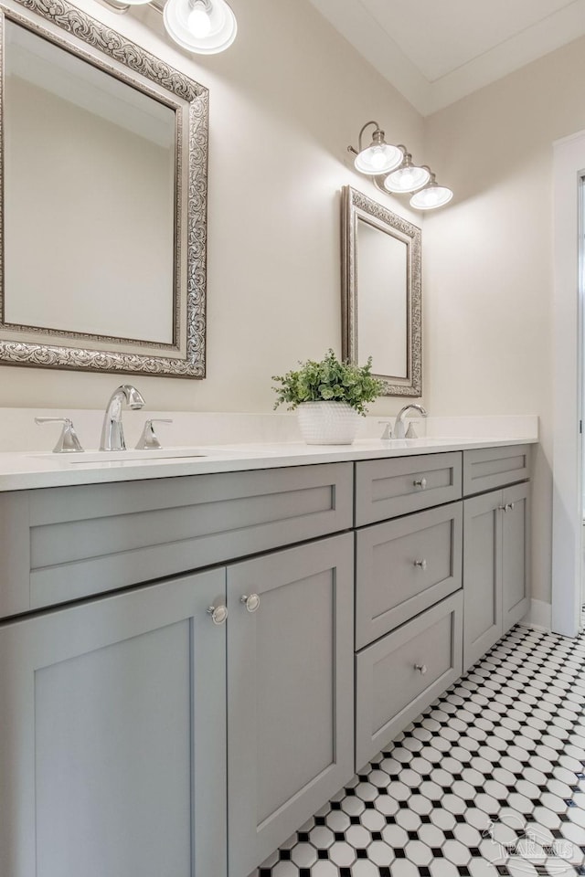 bathroom featuring vanity and ornamental molding