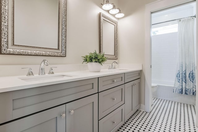 full bathroom featuring tile patterned flooring, vanity, toilet, and shower / bathtub combination with curtain