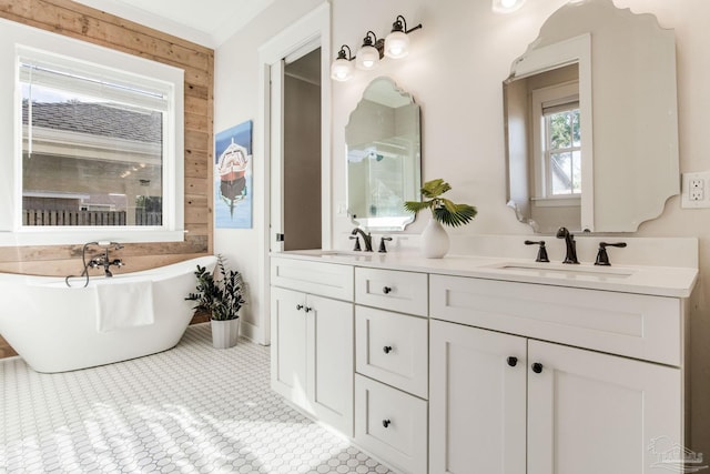 bathroom with tile patterned flooring, vanity, a tub, and wood walls