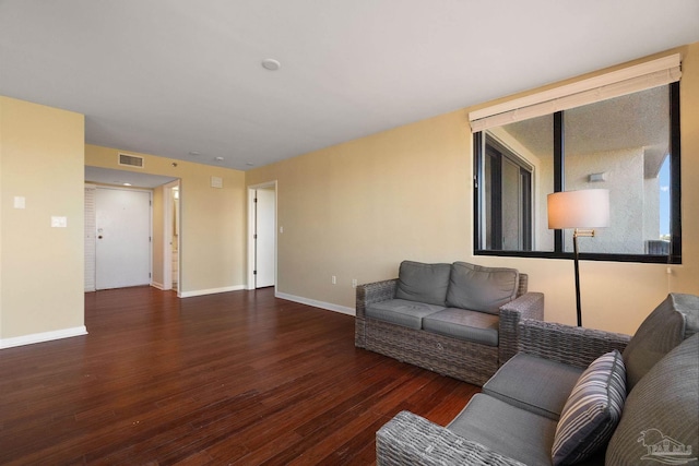 living room featuring dark hardwood / wood-style floors