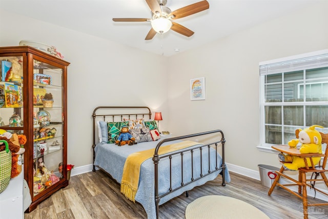 bedroom featuring ceiling fan and wood-type flooring