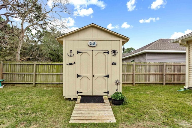 view of outdoor structure with a lawn