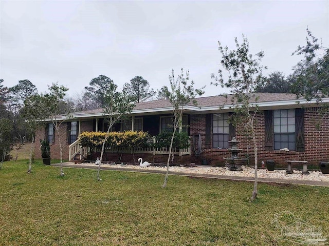 ranch-style home with a front lawn