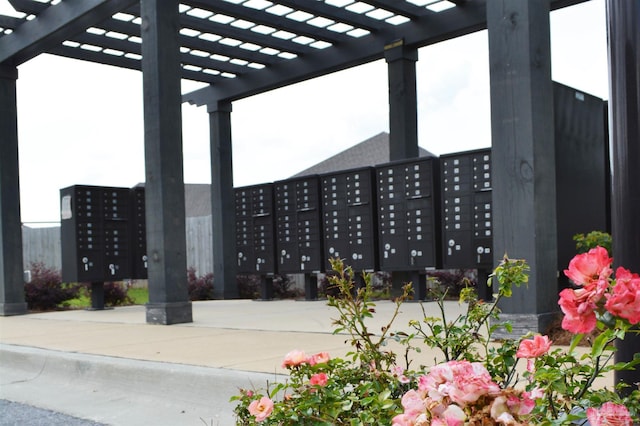 surrounding community with a pergola and a mail area