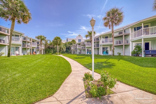 view of home's community featuring a lawn