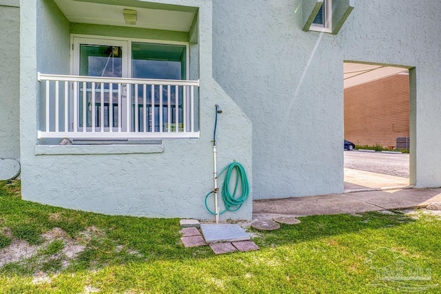 view of property exterior with a yard