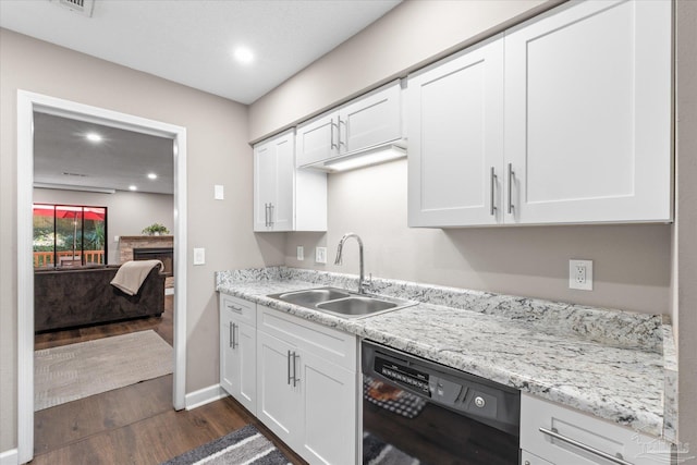 kitchen with black dishwasher, dark hardwood / wood-style flooring, sink, light stone countertops, and white cabinets