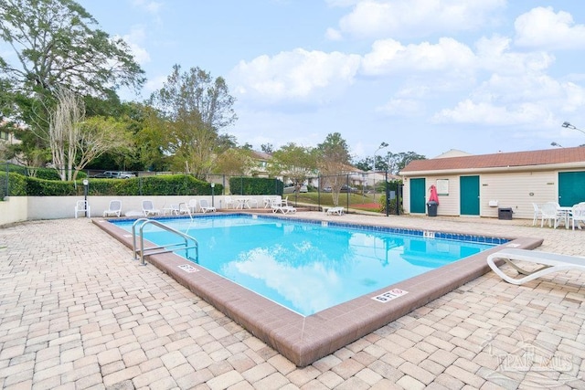 view of swimming pool with a patio area