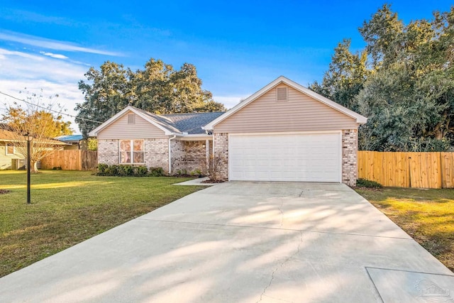 ranch-style house featuring a garage and a front lawn