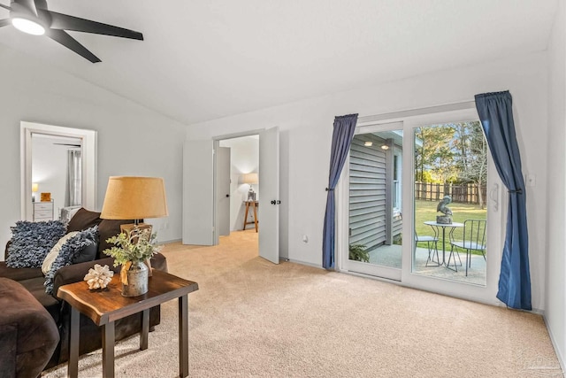 living room with carpet flooring, ceiling fan, and vaulted ceiling