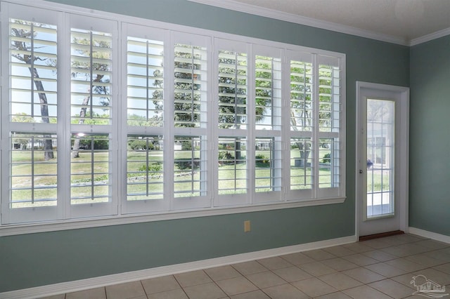 1200 Willowood Ln, Gulf Breeze, FL 32563 - doorway featuring tile patterned floors, a healthy amount of sunlight, baseboards, and ornamental molding