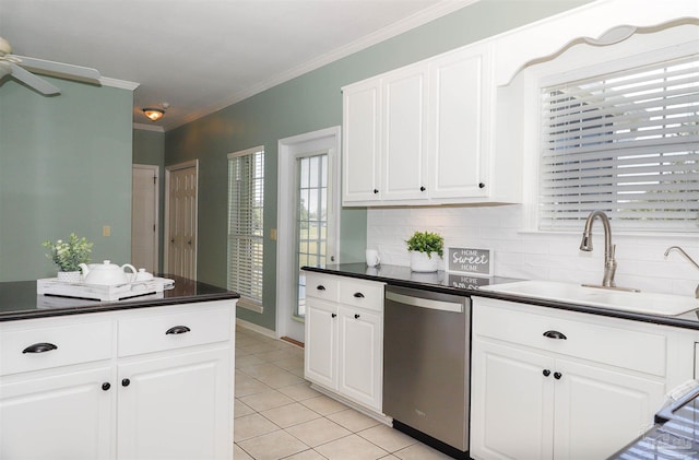 1200 Willowood Ln, Gulf Breeze, FL 32563 - kitchen with light tile patterned floors, backsplash, dark countertops, dishwasher, and a sink