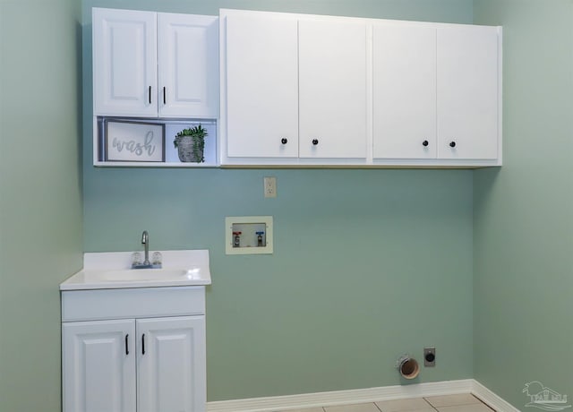 1200 Willowood Ln, Gulf Breeze, FL 32563 - laundry area with hookup for an electric dryer, washer hookup, a sink, baseboards, and cabinet space