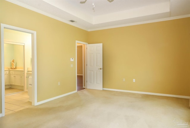 1200 Willowood Ln, Gulf Breeze, FL 32563 - unfurnished bedroom featuring visible vents, baseboards, a tray ceiling, and light colored carpet