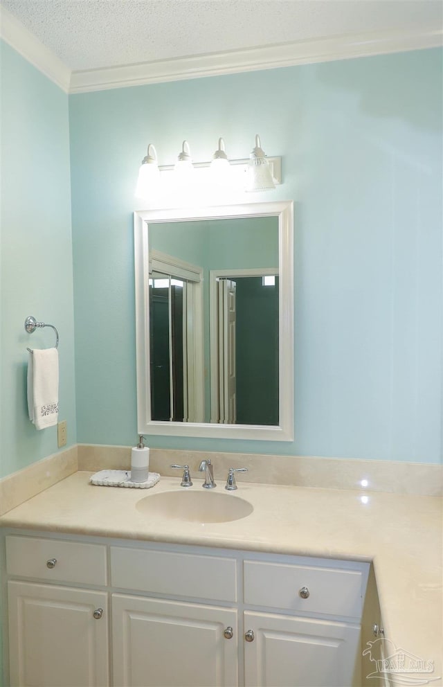 1200 Willowood Ln, Gulf Breeze, FL 32563 - bathroom with vanity, a textured ceiling, and crown molding