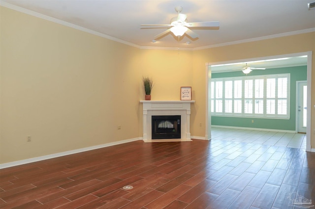 1200 Willowood Ln, Gulf Breeze, FL 32563 - unfurnished living room with a fireplace with flush hearth, crown molding, dark wood finished floors, and a ceiling fan