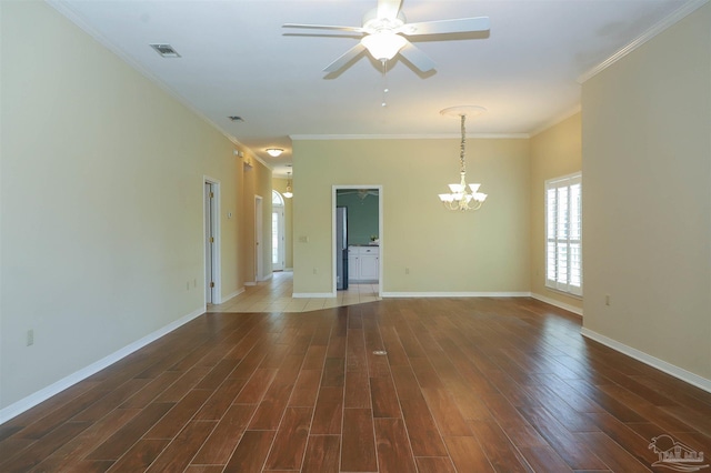 1200 Willowood Ln, Gulf Breeze, FL 32563 - spare room featuring baseboards, ornamental molding, visible vents, ceiling fan with notable chandelier, and wood finished floors