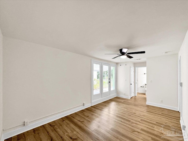 unfurnished room with french doors, ceiling fan, and light hardwood / wood-style floors