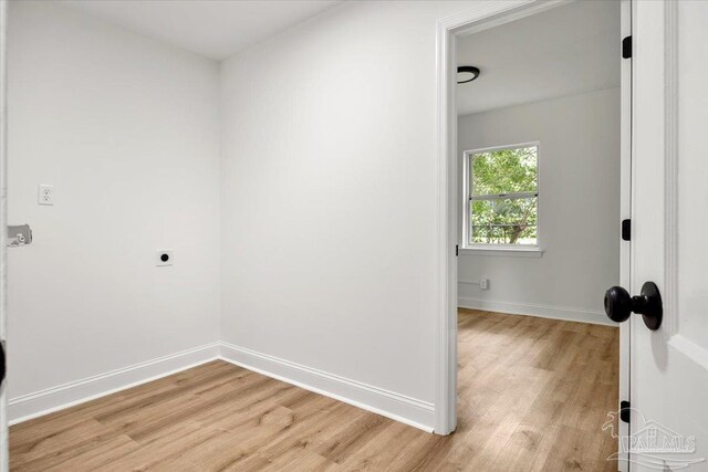 spare room featuring light hardwood / wood-style floors