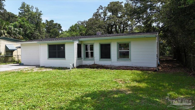 ranch-style house with a front lawn